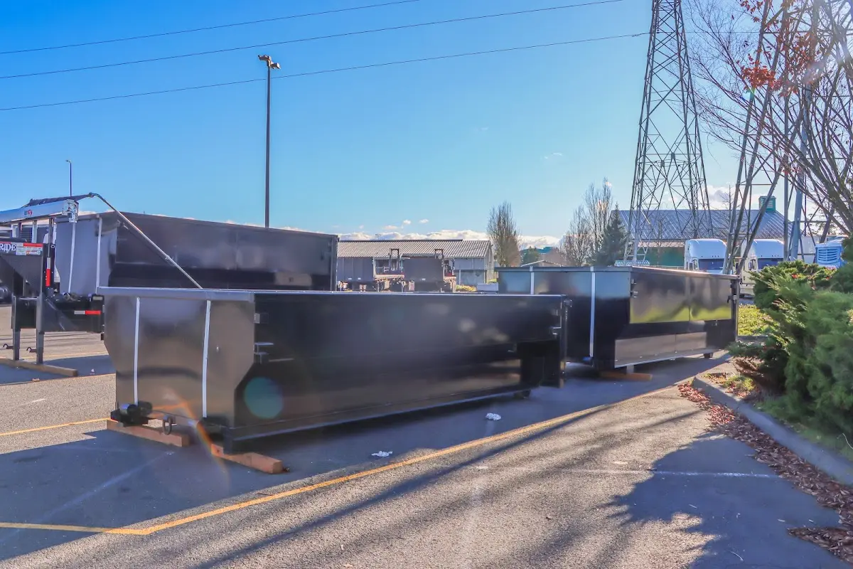 Roll-off dumpster ready for waste disposal at job site for 3 Yard Dumpster Rental in Roswell